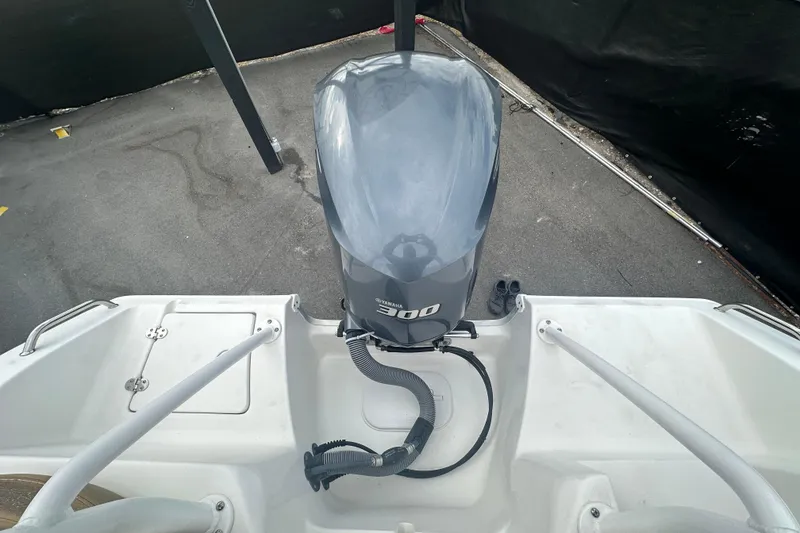 Slide: The Image of Open storage compartment on 2020 Sea Hunt Ultra 255 SE boat with rope and anchor. - 143