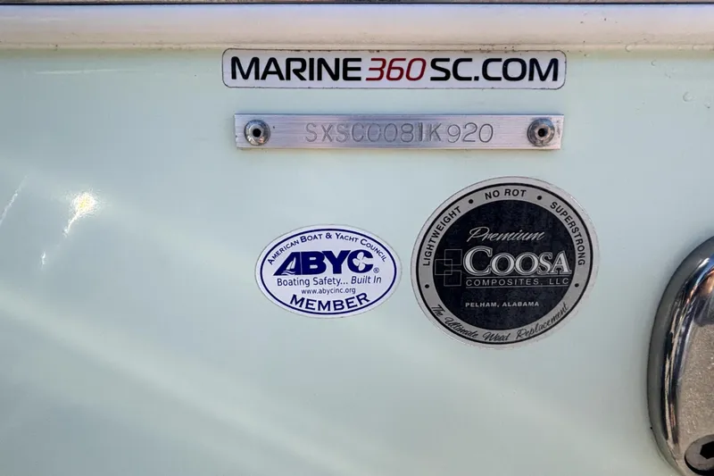 Slide: The Image of 2020 Sea Hunt Ultra 255 SE boat with 300 horsepower engine, parked outdoors. - 15