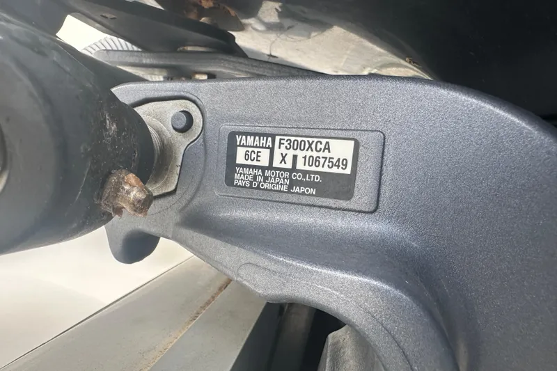 Slide: The Image of 2020 Sea Hunt Ultra 255 SE boat on display at a marina under cloudy skies. - 17