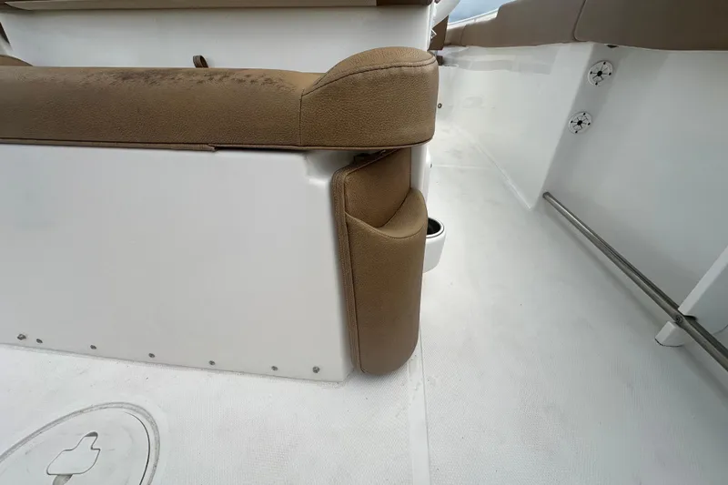 Slide: The Image of 2020 Sea Hunt Ultra 255 SE boat seat with brown upholstery and footrest. - 33