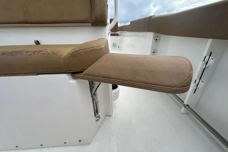 Slide: The Image of 2020 Sea Hunt Ultra 255 SE boat interior with speakers and rod holders. - 34