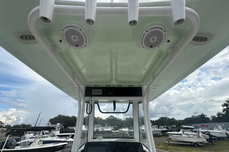Slide: The Image of 2020 Sea Hunt Ultra 255 SE boat interior with steering wheel and seating. - 36