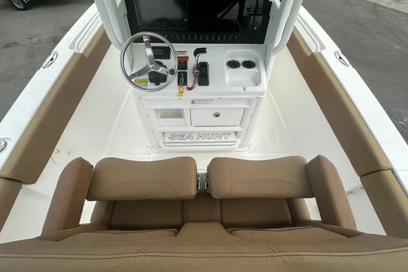 Slide: The Image of 2020 Sea Hunt Ultra 255 SE boat interior with steering console and seating. - 38