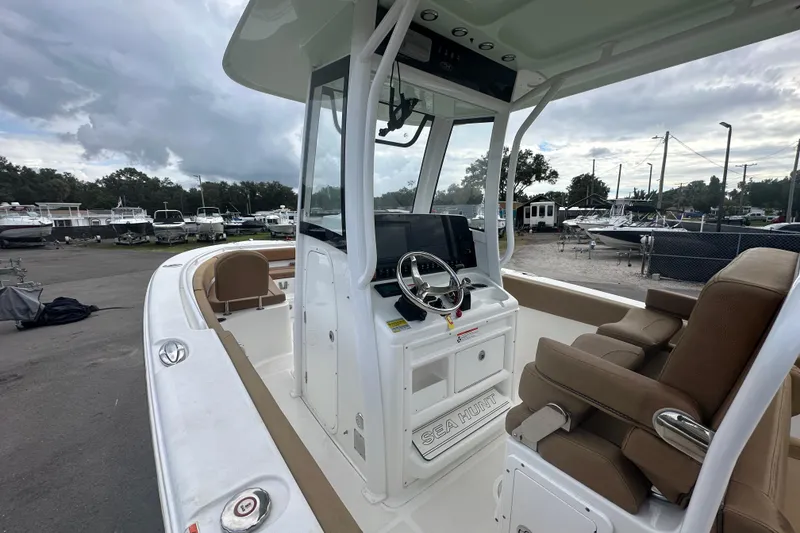 Slide: The Image of 2020 Sea Hunt Ultra 255 SE boat interior with helm, seating, and navigation equipment. - 39