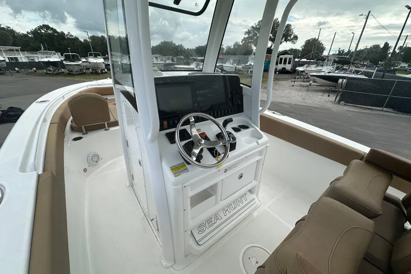 Slide: The Image of 2020 Sea Hunt Ultra 255 SE boat interior with steering wheel and control panel. - 40