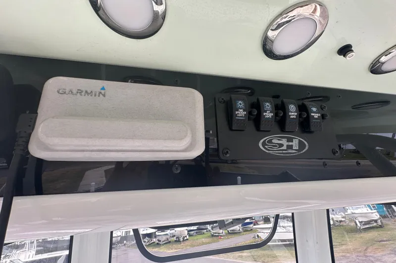 Slide: The Image of 2020 Sea Hunt Ultra 255 SE boat dashboard with navigation display and steering wheel. - 44