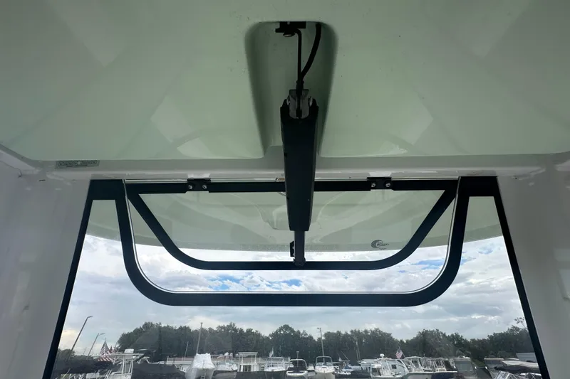 Slide: The Image of 2020 Sea Hunt Ultra 255 SE boat dashboard with navigation screen and steering wheel. - 45