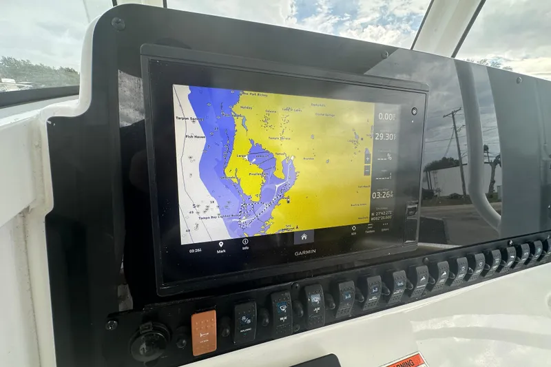 Slide: The Image of Control panel of a 2020 Sea Hunt Ultra 255 SE boat with Garmin navigation. - 48