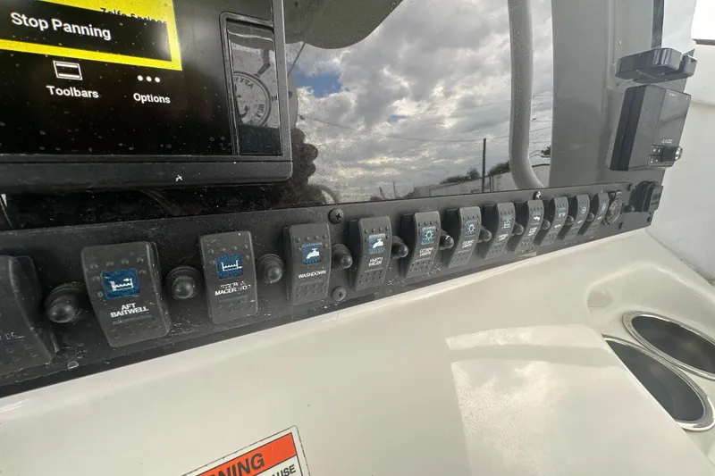 Slide: The Image of JL Audio MediaMaster 50 on 2020 Sea Hunt Ultra 255 SE boat dashboard. - 51