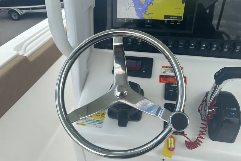 Slide: The Image of 2020 Sea Hunt Ultra 255 SE boat compartment with warning label and logo. - 57