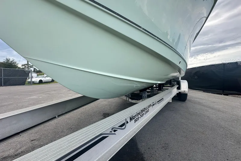 Slide: The Image of 2020 Sea Hunt Ultra 255 SE boat on trailer, side view. - 8
