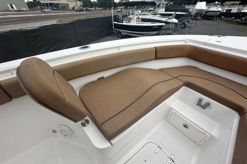 Slide: The Image of Open storage compartment on a 2020 Sea Hunt Ultra 255 SE boat. - 80