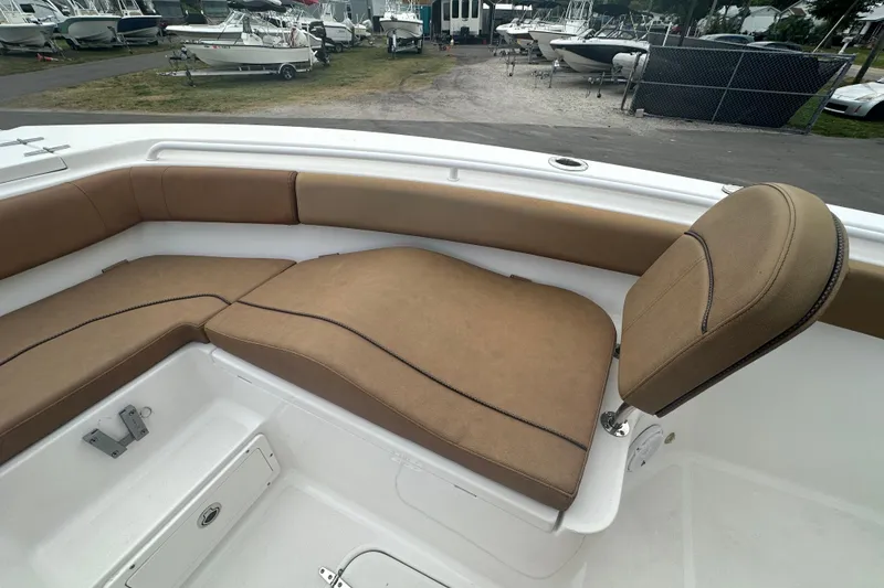 Slide: The Image of Open storage compartment on 2020 Sea Hunt Ultra 255 SE boat. - 83