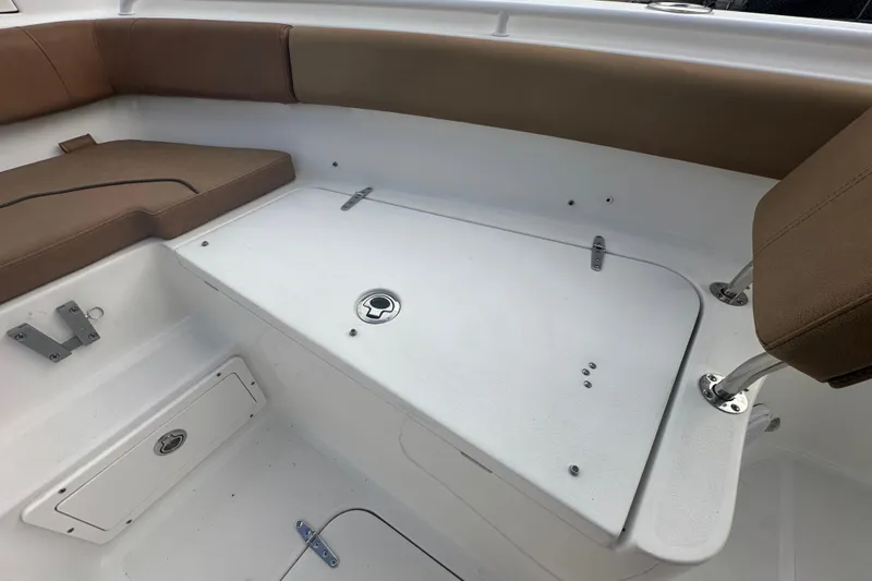 Slide: The Image of 2020 Sea Hunt Ultra 255 SE boat deck with storage compartment. - 84