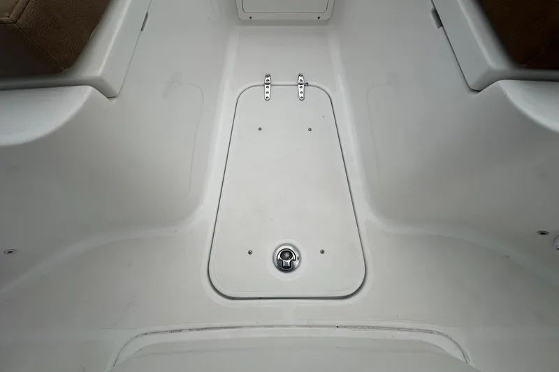 Slide: The Image of Storage compartment of 2020 Sea Hunt Ultra 255 SE boat, showing interior details. - 86