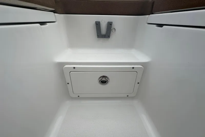 Slide: The Image of Open storage compartment on 2020 Sea Hunt Ultra 255 SE boat. - 89