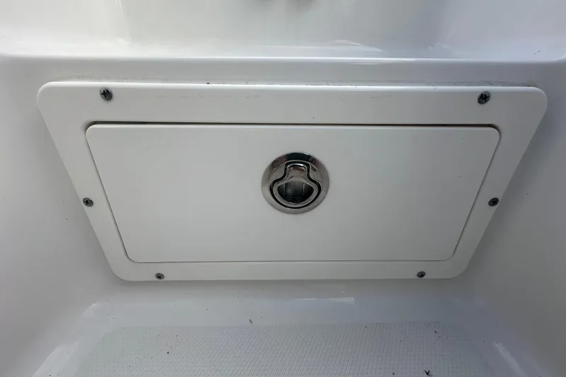 Slide: The Image of 2020 Sea Hunt Ultra 255 SE boat with tan seating and white deck. - 90