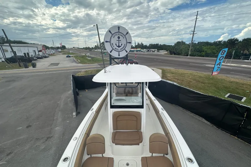 Slide: The Image of 2020 Sea Hunt Ultra 255 SE boat with spacious seating and sleek design. - 95