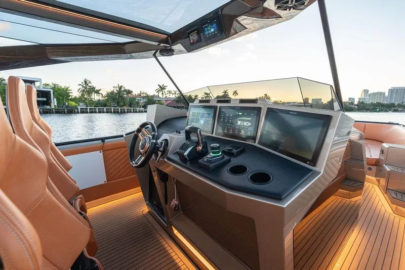 Slide: The Image of Luxurious 2023 DeKoning 43 yacht interior with advanced navigation system and leather seating. - 10