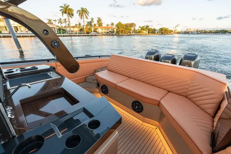 Slide: The Image of Luxurious 2023 DeKoning 43 yacht interior with leather seating and sleek design on a scenic waterway. - 16