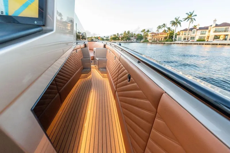 Slide: The Image of Luxurious 2023 DeKoning 43 yacht interior with elegant seating and waterfront view. - 19