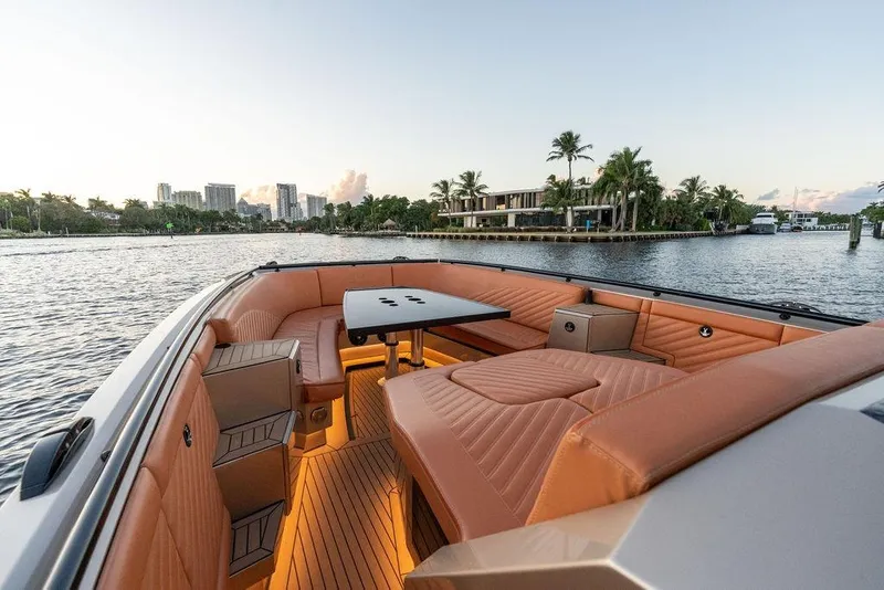 Slide: The Image of Luxurious 2023 DeKoning 43 boat interior with elegant seating and waterfront view. - 21