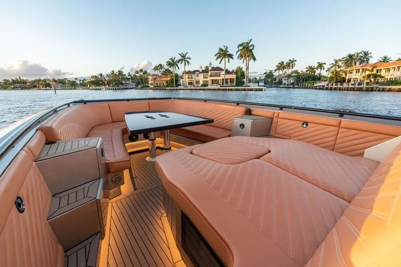 Slide: The Image of Luxurious 2023 DeKoning 43 yacht interior with elegant seating and scenic waterfront view. - 22