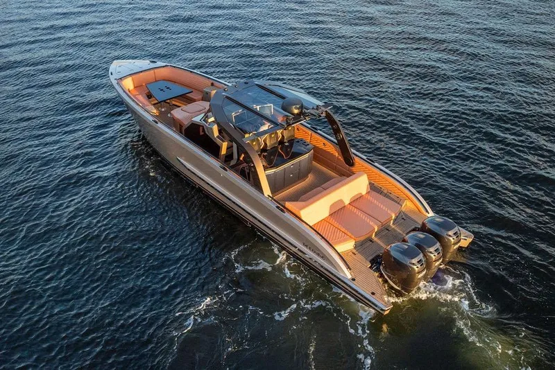 Slide: The Image of Luxury DeKoning 43 yacht cruising on open water, 2023 model, with sleek design and powerful engines. - 3