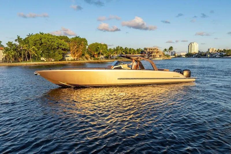 Slide: The Image of Luxury DeKoning 43 boat cruising on a sunny day, 2023 model. - 4