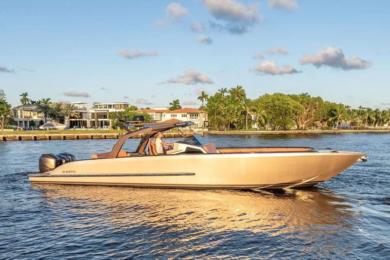Slide: The Image of Luxury DeKoning 43 boat cruising on a sunny day, 2023 model. - 7