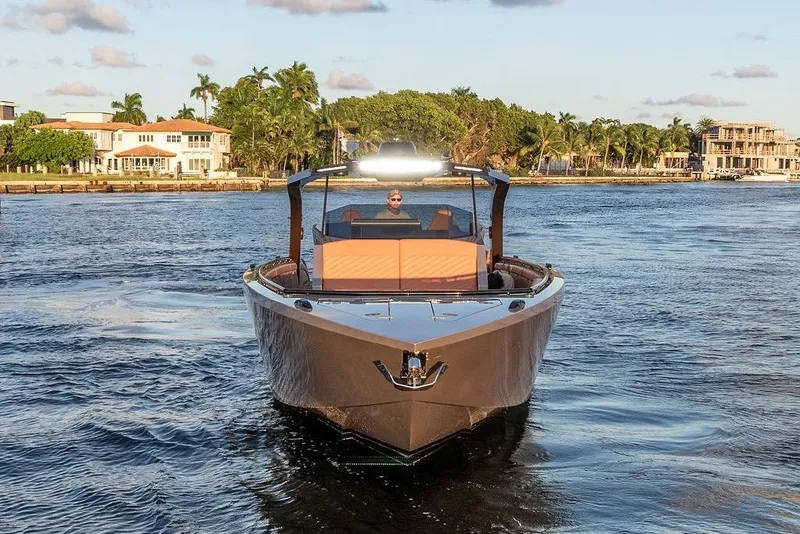 Slide: The Image of Luxury DeKoning 43 yacht cruising on a scenic waterway, 2023 model. - 8