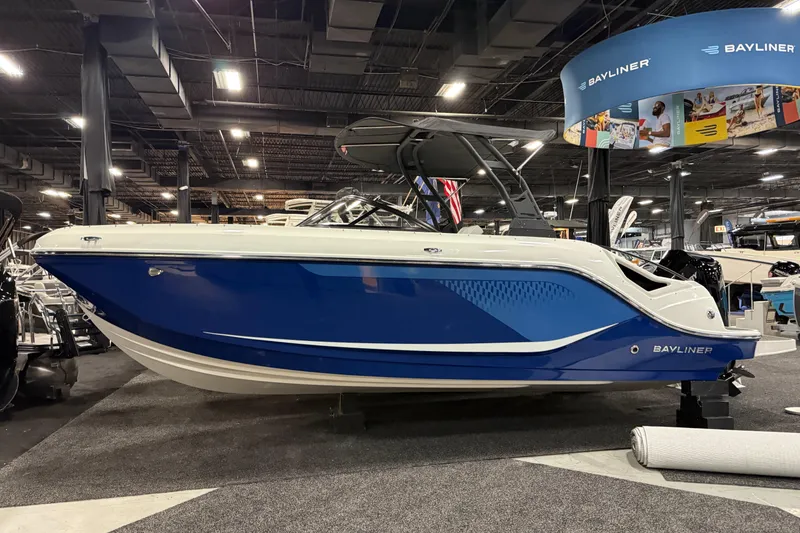 The Image of 2026 Bayliner D22 boat displayed at an indoor exhibition, featuring a sleek blue and white design. - 0