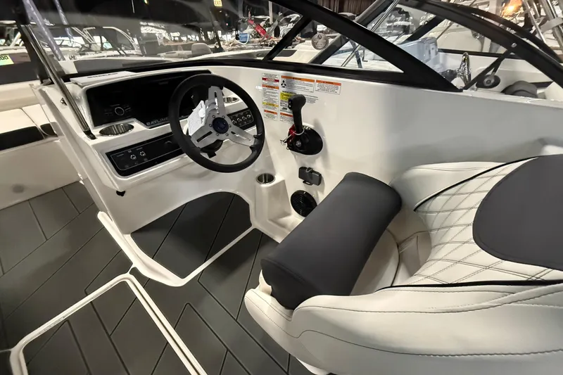 Slide: The Image of 2026 Bayliner D22 boat interior with steering wheel and modern dashboard design. - 3