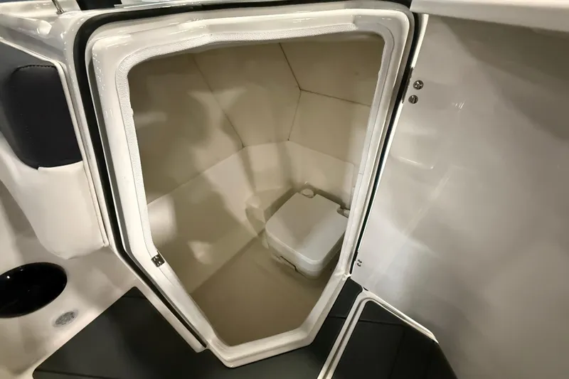Slide: The Image of 2026 Bayliner D22 boat interior with compact toilet compartment. - 5