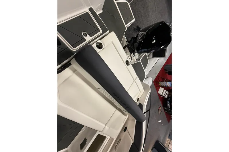 Slide: The Image of 2026 Bayliner D22 boat interior with sleek design and modern outboard motor. - 6