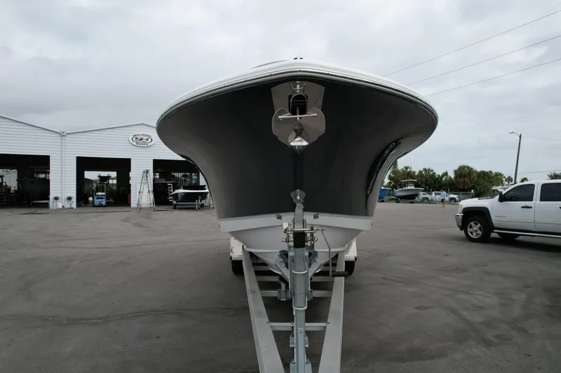 Slide: The Image of 2026 Sea Hunt Gamefish 27 Forward Seating boat on trailer at dealership lot. - 1