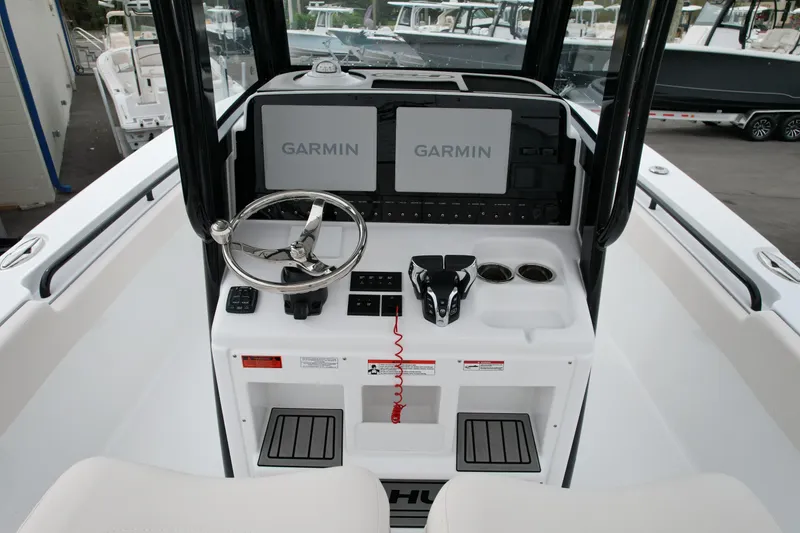 Slide: The Image of 2026 Sea Hunt Gamefish 27 helm with Garmin displays and modern controls. - 5