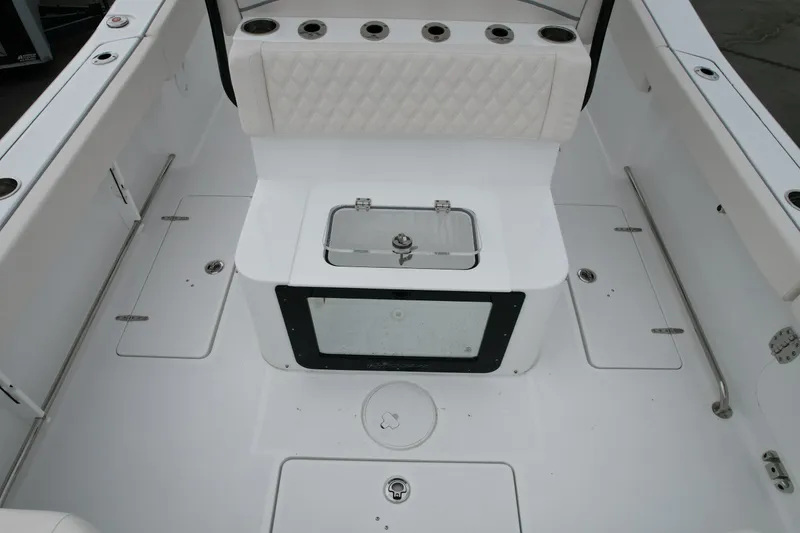 Slide: The Image of 2026 Sea Hunt Gamefish 27 Forward Seating boat interior with storage compartments. - 7