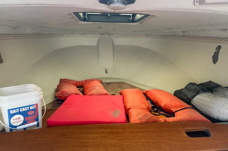 Slide: The Image of Interior of 1980 Boston Whaler Revenge 20 with life jackets and bait cast net. - 10