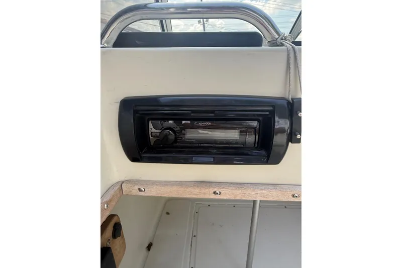 Slide: The Image of 1980 Boston Whaler Revenge 20 boat interior with Kenwood stereo system. - 13