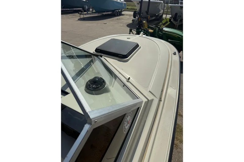Slide: The Image of 1980 Boston Whaler Revenge 20 boat deck with windshield and hatch. - 16