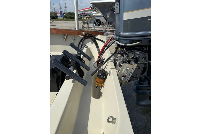 Slide: The Image of 1980 Boston Whaler Revenge 20 boat interior with motor and equipment. - 24