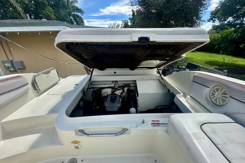Slide: The Image of 2010 Sea Ray 280 Sundeck boat engine compartment open, revealing interior components. - 28