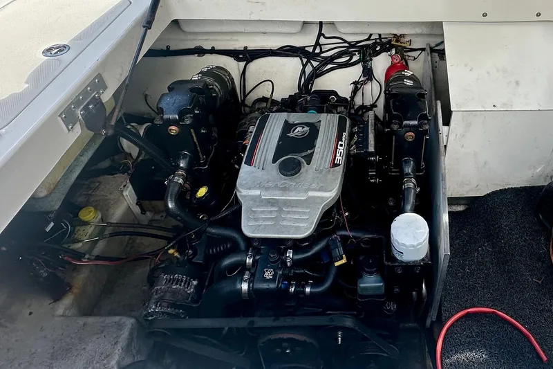 Slide: The Image of Engine compartment of a 2010 Sea Ray 280 Sundeck boat, featuring a MerCruiser 350 engine. - 30