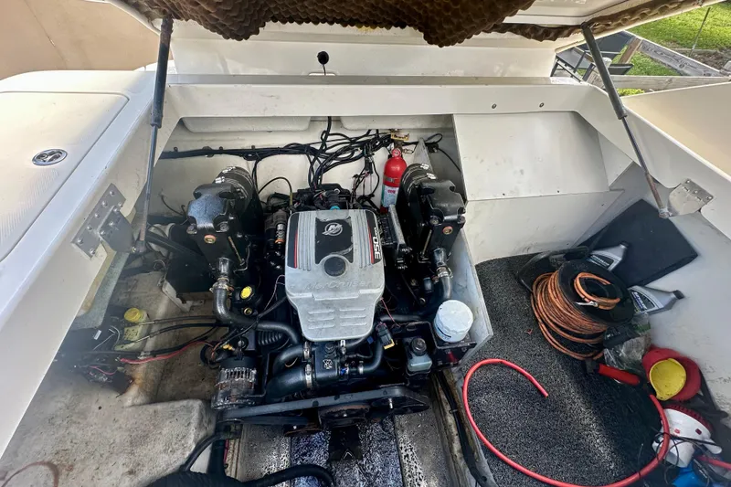 Slide: The Image of Engine compartment of a 2010 Sea Ray 280 Sundeck with visible MerCruiser engine. - 31