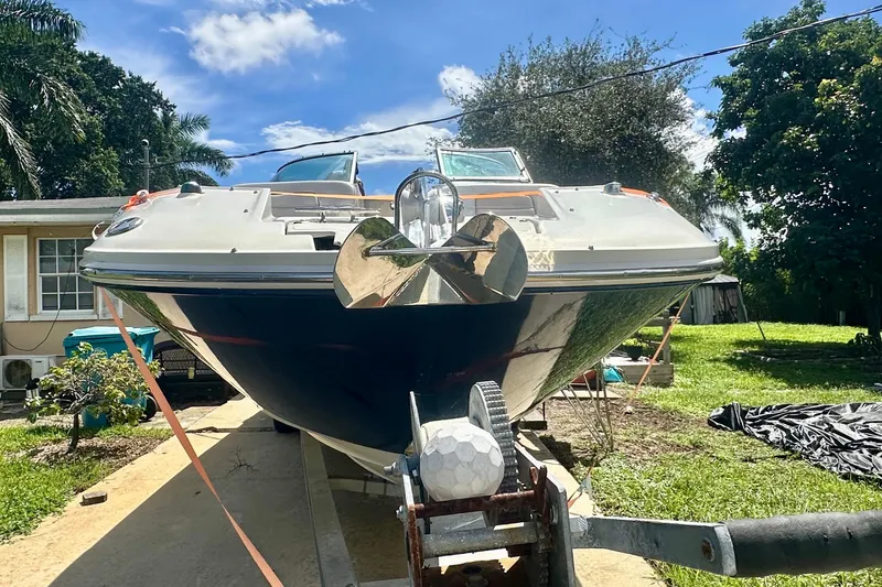 Slide: The Image of 2010 Sea Ray 280 Sundeck boat on trailer, sunny day, residential background. - 7