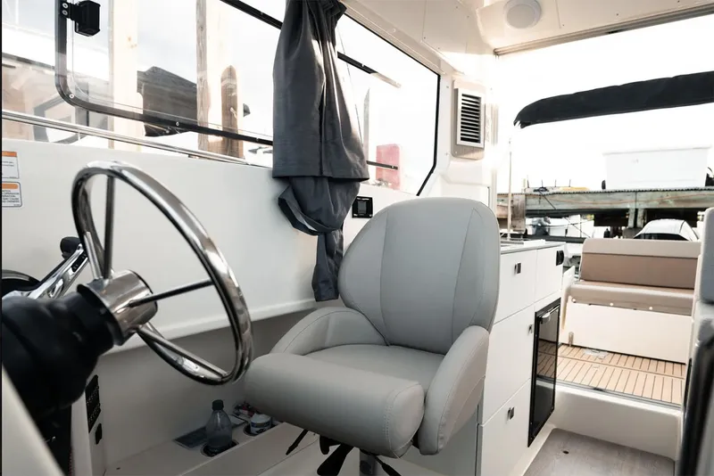 Slide: The Image of Manufacturer Provided Image: 2025 Bayliner Trophy T25 Explorer interior with steering wheel and comfortable seating. - 5