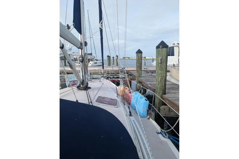 Slide: The Image of Catalina 350 MkII sailboat docked at marina, 2008 model, with visible deck and rigging. - 10