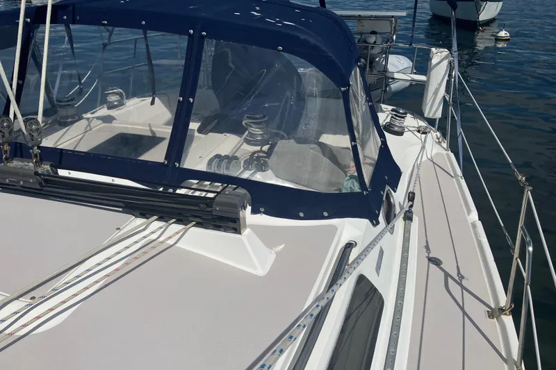 Slide: The Image of 2008 Catalina 350 MkII sailboat deck with blue canopy and rigging. - 11