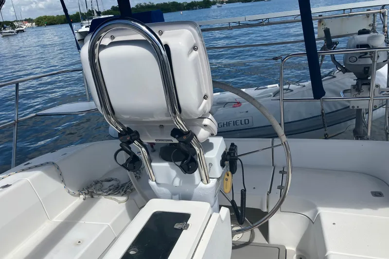 Slide: The Image of Cockpit of 2008 Catalina 350 MkII sailboat with steering wheel and ocean view. - 2